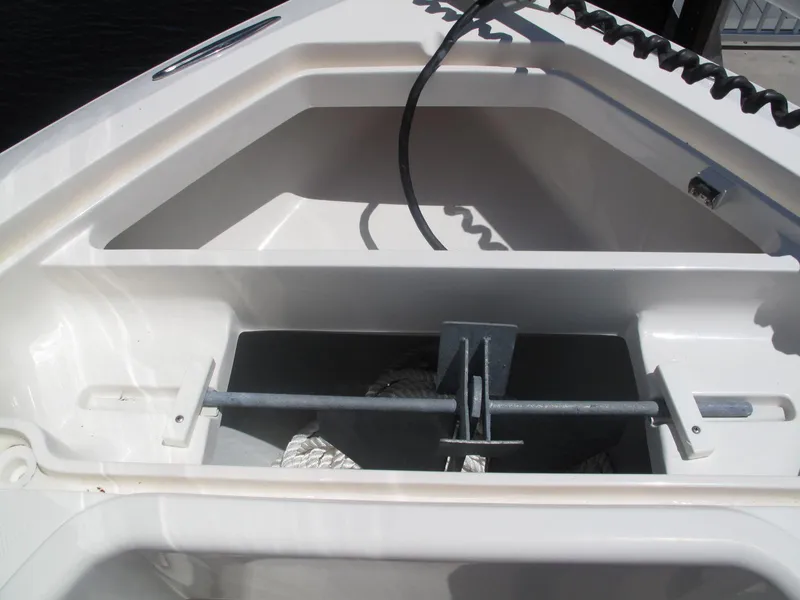 Slide: The Image of 2020 SeaVee 290B boat anchor storage compartment with rope and anchor. - 10