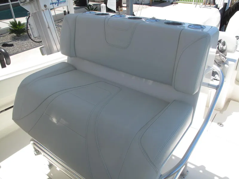 Slide: The Image of 2020 SeaVee 290B boat seat with cup holders and sleek design. - 17