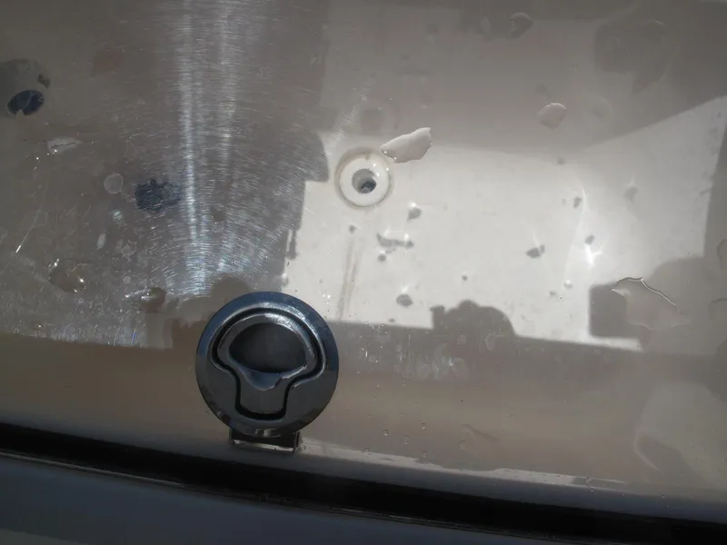 Slide: The Image of Close-up of a 2020 SeaVee 290B boat's stainless steel surface with water droplets. - 19