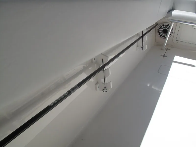 Slide: The Image of 2020 SeaVee 290B boat interior with rod holder and speaker. - 21
