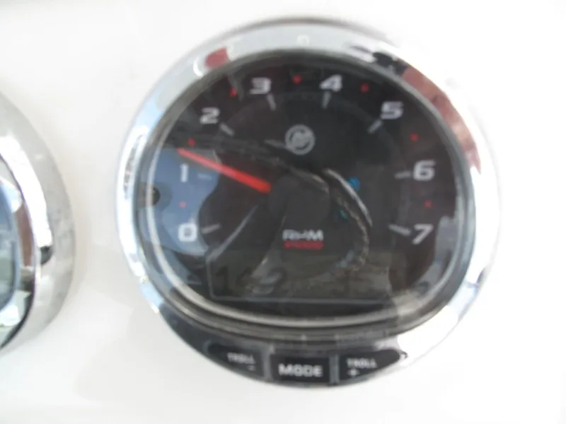 Slide: The Image of Close-up of a 2020 SeaVee 290B boat tachometer displaying RPM. - 24