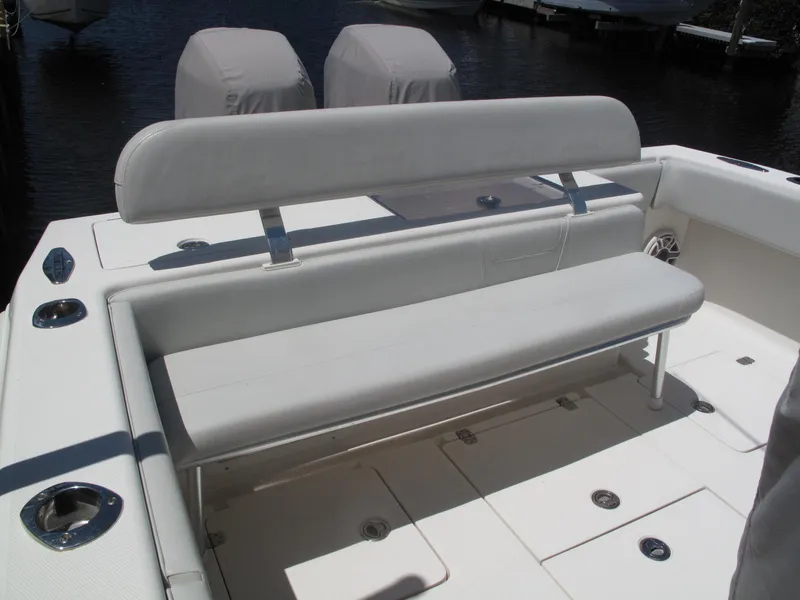 Slide: The Image of 2020 SeaVee 290B boat interior with cushioned seating and storage compartments. - 6