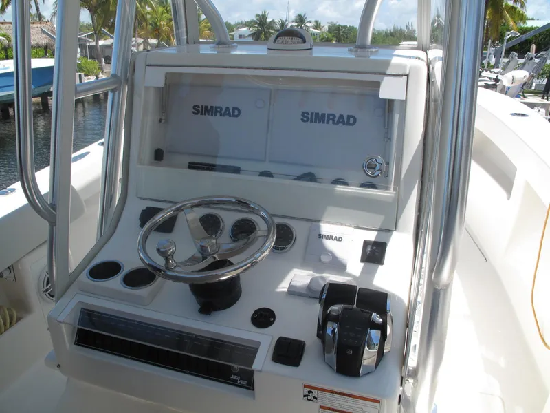 Slide: The Image of 2020 SeaVee 290B boat console with Simrad electronics and steering wheel. - 8