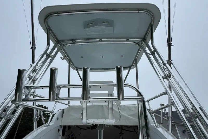 Slide: The Image of 1964 Bertram 31 Flybridge Cruiser with stainless steel railings and canopy. - 15