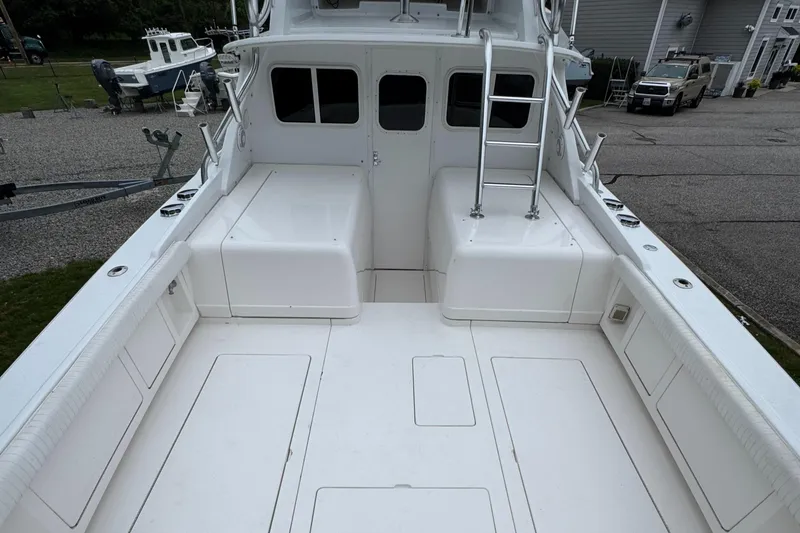 Slide: The Image of 1964 Bertram 31 Flybridge Cruiser deck with ladder and seating area. - 4