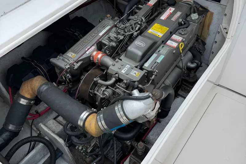 Slide: The Image of Engine compartment of a 1964 Bertram 31 Flybridge Cruiser, showcasing detailed mechanical components. - 6