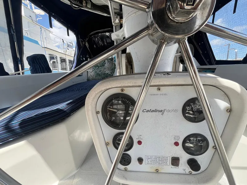 Slide: The Image of Steering wheel and control panel of a 1999 Catalina 42 MkII yacht. - 15