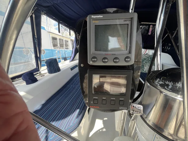 Slide: The Image of Cockpit of 1999 Catalina 42 MkII sailboat with navigation instruments and blue seating. - 16