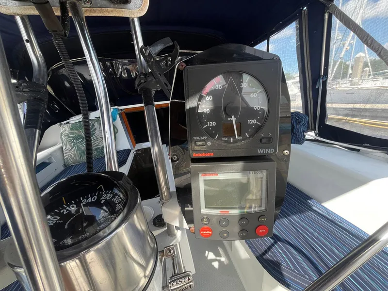 Slide: The Image of Cockpit instruments of a 1999 Catalina 42 MkII sailboat, featuring wind and navigation displays. - 17