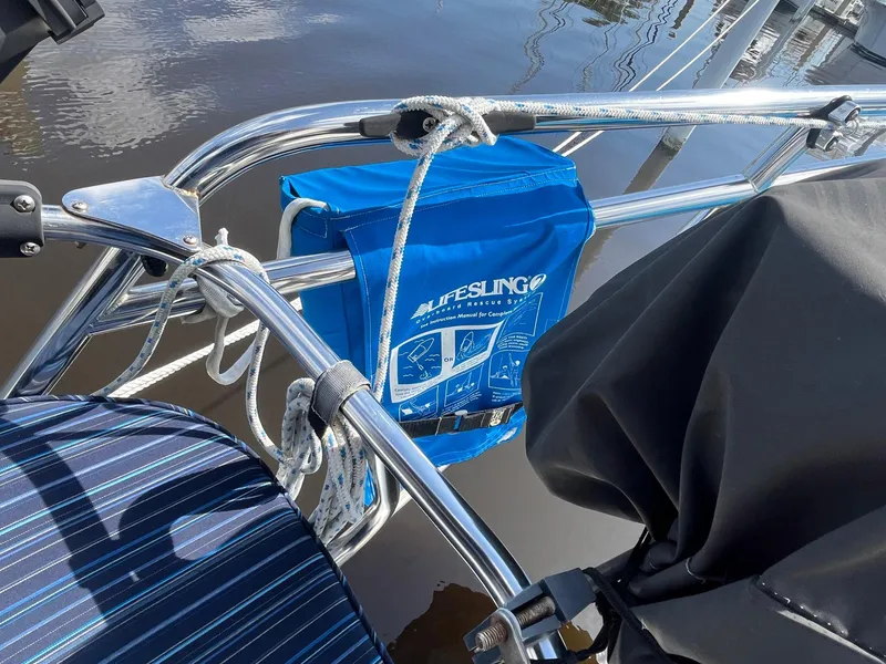 Slide: The Image of Blue lifesaving equipment on a 1999 Catalina 42 MkII sailboat railing. - 22