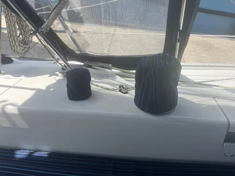 Slide: The Image of Sailboat deck of 1999 Catalina 42 MkII with covered winches and rigging. - 26