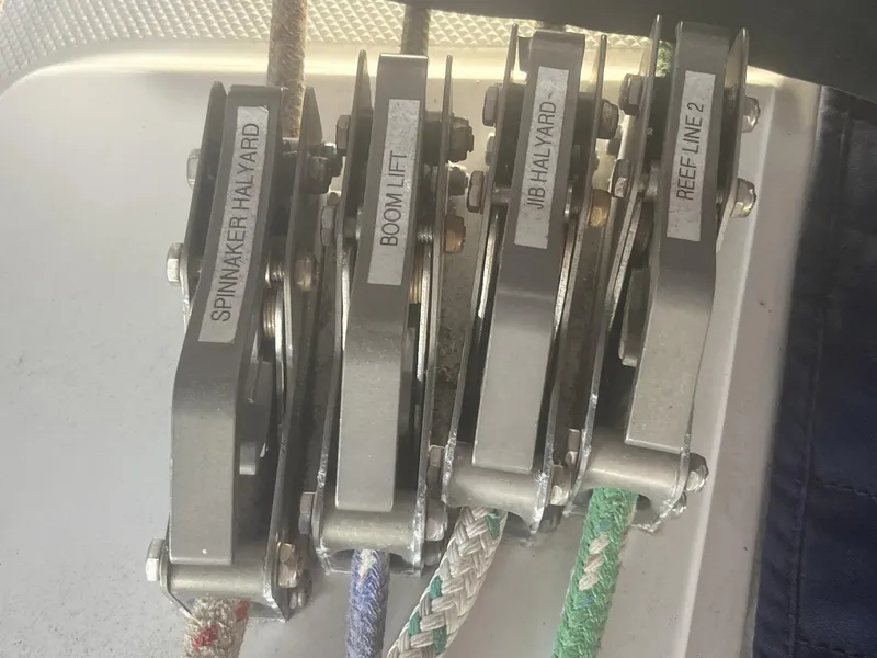 Slide: The Image of Close-up of labeled halyard clutches on a 1999 Catalina 42 MkII sailboat. - 27