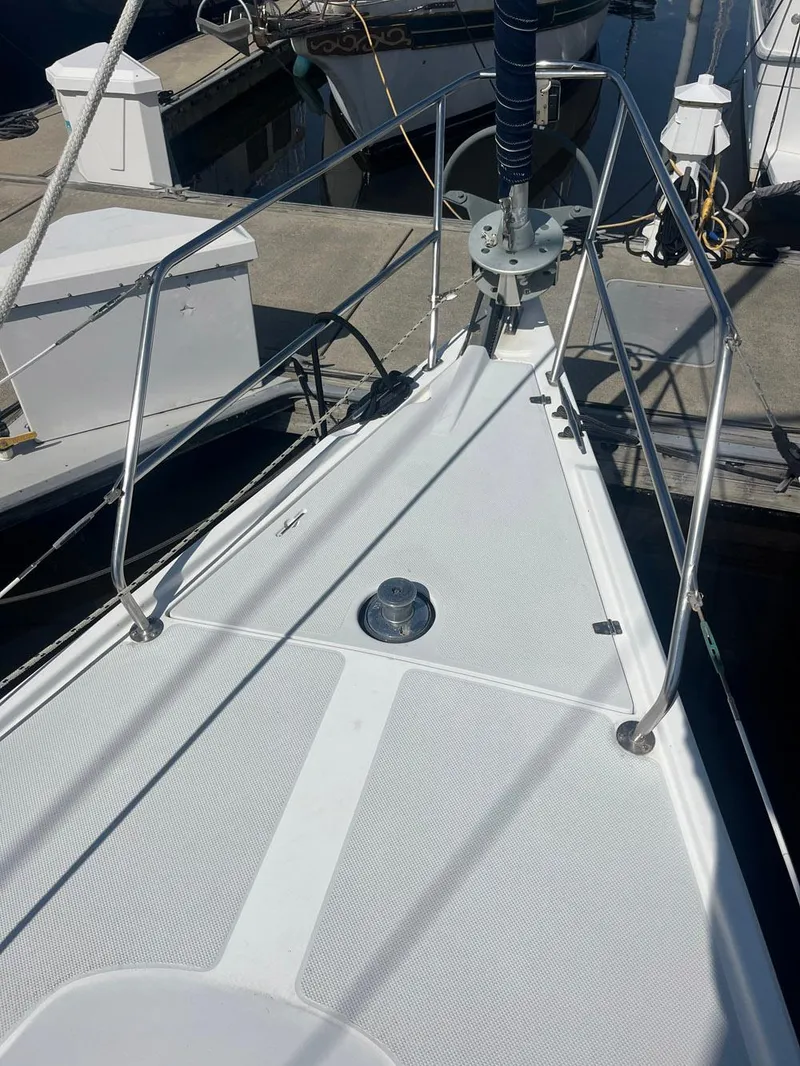 Slide: The Image of Bow of a 1999 Catalina 42 MkII sailboat at a marina dock. - 31