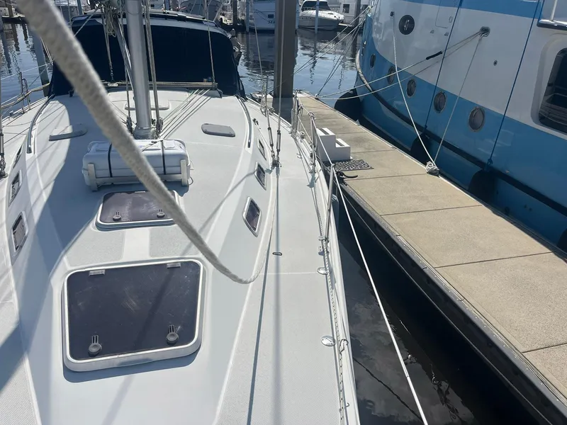 Slide: The Image of Sailboat Catalina 42 MkII, 1999 model, docked at marina with visible deck and rigging. - 36