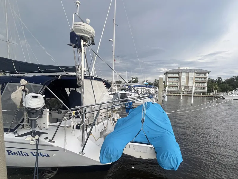 Slide: The Image of Sailboat Catalina 42 MkII, 1999, docked at marina with blue cover, overcast sky. - 45