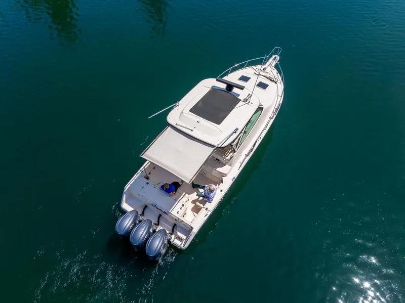 Slide: The Image of 2019 Grady-White Express boat on clear blue water, aerial view. - 10