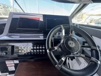 Slide: The Image of 2020 Cruisers Yachts 38 GLS helm with modern controls and steering wheel. - 13