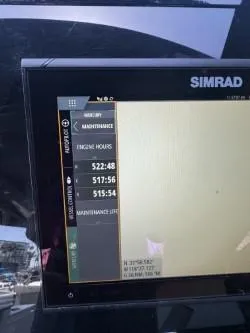Slide: The Image of Simrad display showing engine hours on 2020 Cruisers Yachts 38 GLS. - 14