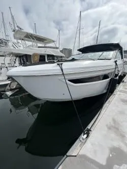 Slide: The Image of 2020 Cruisers Yachts 38 GLS docked at marina, sleek white design. - 4