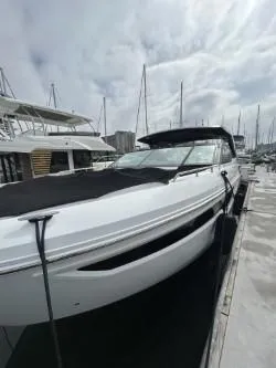 Slide: The Image of 2020 Cruisers Yachts 38 GLS docked at marina under cloudy sky. - 5