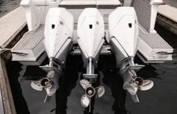 Slide: The Image of Triple outboard engines on a 2020 Cruisers Yachts 38 GLS at a dock. - 7
