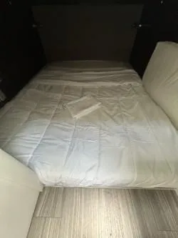 Slide: The Image of 2020 Cruisers Yachts 38 GLS cabin interior with a neatly made bed. - 22