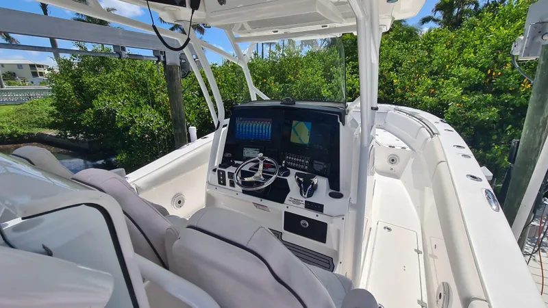 Slide: The Image of 2021 Sea Fox 328 Commander boat cockpit with advanced navigation system and seating. - 13