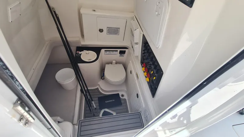 Slide: The Image of Interior of 2021 Sea Fox 328 Commander boat with toilet and control panel. - 18