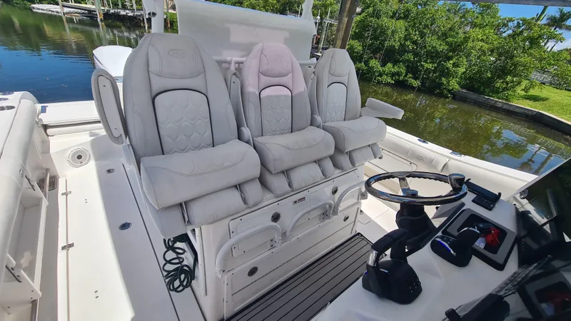 Slide: The Image of 2021 Sea Fox 328 Commander boat interior with luxurious seating and steering console. - 19