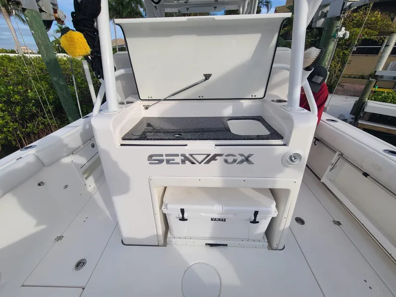 Slide: The Image of 2021 Sea Fox 328 Commander boat deck with storage and cooler. - 22