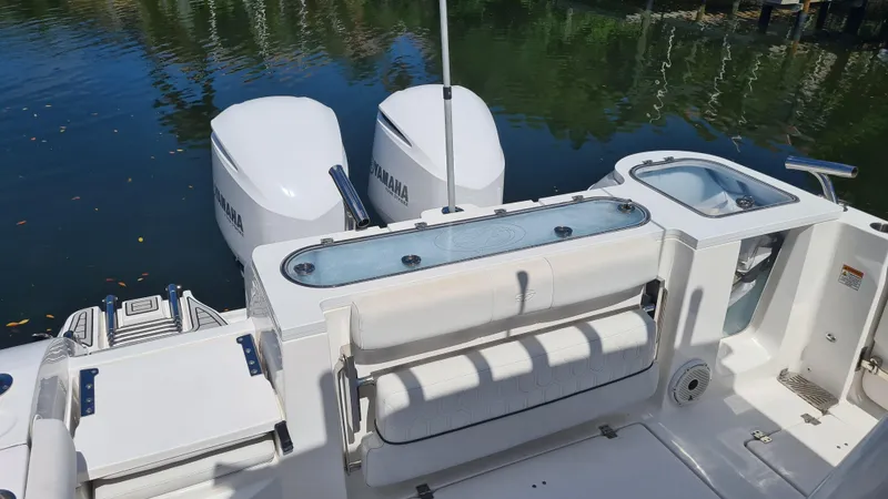 Slide: The Image of 2021 Sea Fox 328 Commander boat with dual Yamaha engines on calm water. - 25