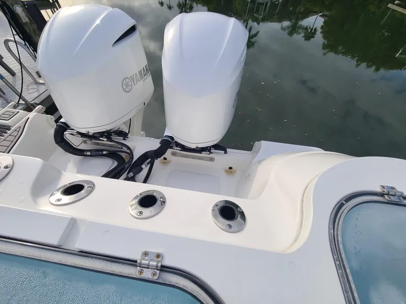 Slide: The Image of 2021 Sea Fox 328 Commander with dual Yamaha outboard engines at dock. - 26