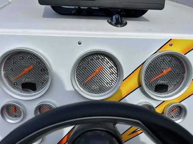 Slide: The Image of Dashboard of a 2021 Velocity 290 SC boat with carbon fiber gauges. - 16
