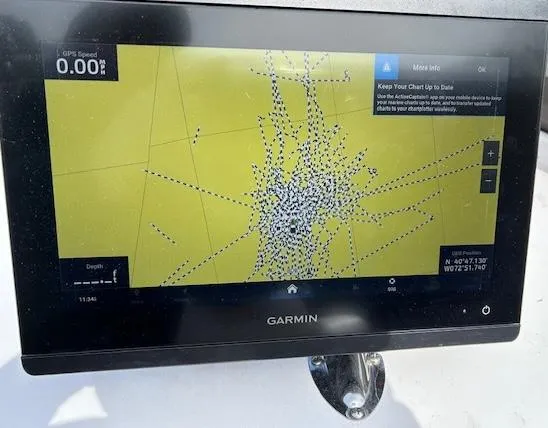 Slide: The Image of Garmin GPS display on 2021 Velocity 290 SC boat, showing nautical chart and coordinates. - 17