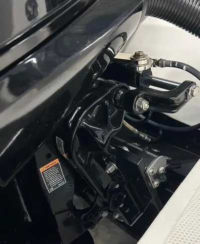 Slide: The Image of Close-up of 2021 Velocity 290 SC boat engine components, showcasing mechanical details and connections. - 4