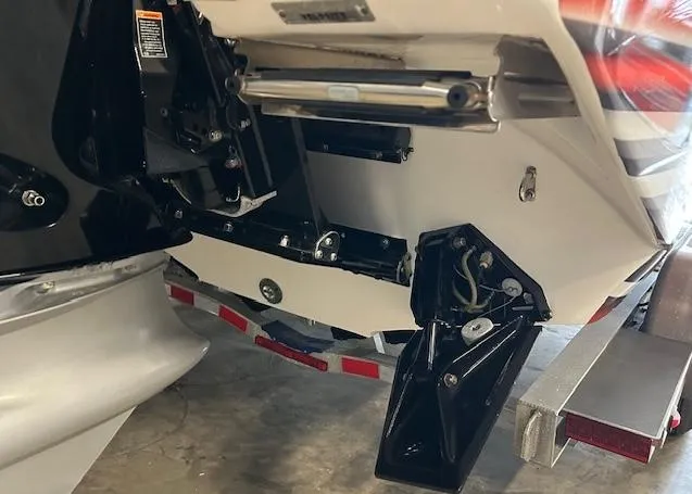 Slide: The Image of Rear view of a 2021 Velocity 290 SC boat on a trailer in a garage. - 5