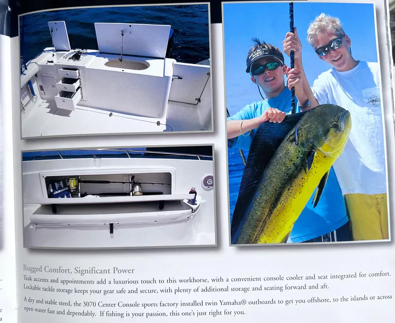 Slide: The Image of 2001 Pursuit 3070 Center Console boat with fishing features and anglers holding a large fish. - 34