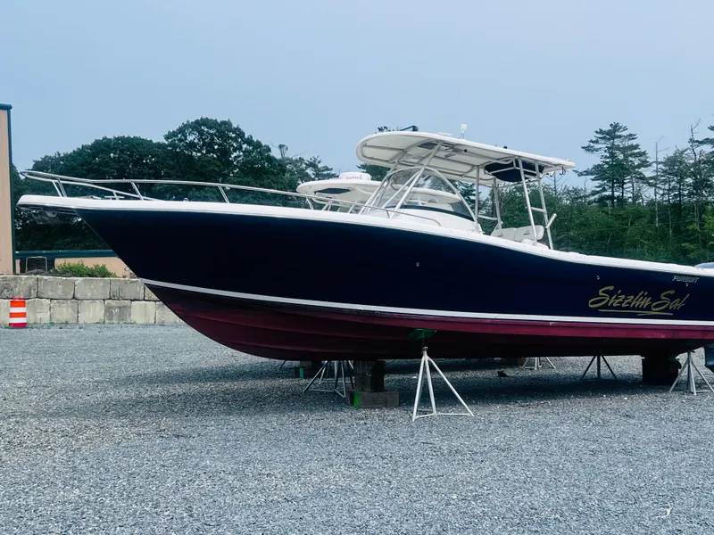 Slide: The Image of 2001 Pursuit 3070 Center Console boat with T-top and spacious deck. - 35