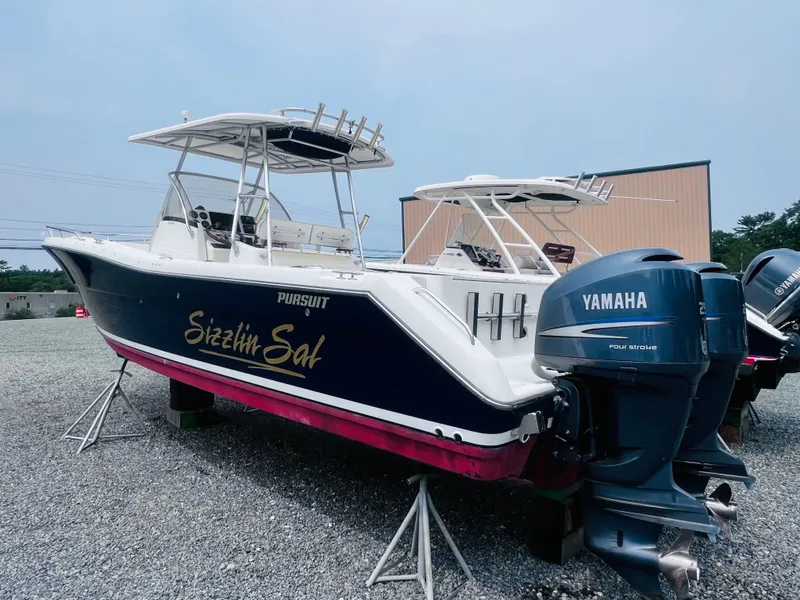 Slide: The Image of 2001 Pursuit 3070 Center Console boat on display, featuring sleek design and spacious deck. - 43