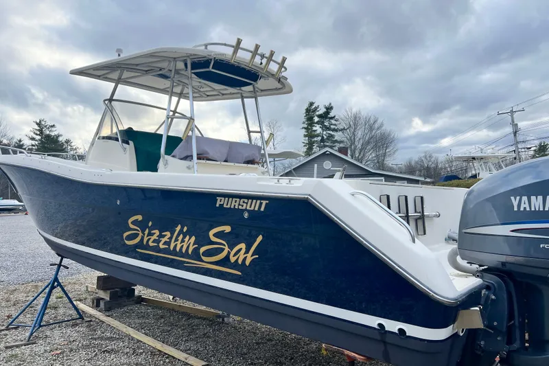 Slide: The Image of 2001 Pursuit 3070 Center Console boat on display with Yamaha engine. - 52
