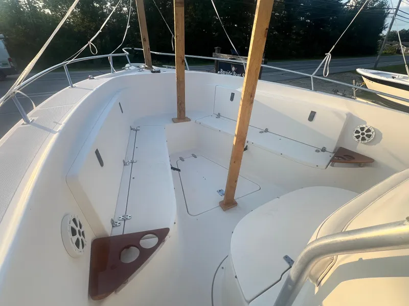 Slide: The Image of 2001 Pursuit 3070 Center Console boat interior with seating and cup holders. - 8