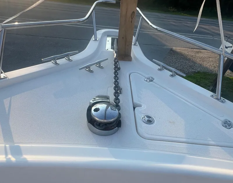 Slide: The Image of Bow of a 2001 Pursuit 3070 Center Console boat with anchor chain and cleats. - 9