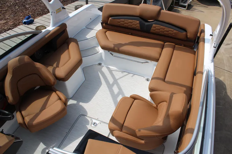 Slide: The Image of 2025 Four Winns HD3 OB boat interior with luxurious brown seating and modern design. - 13