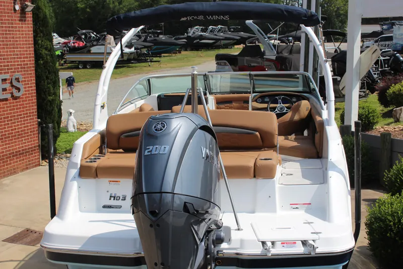 Slide: The Image of 2025 Four Winns HD3 OB boat with Yamaha 200 outboard motor, displayed outdoors. - 6