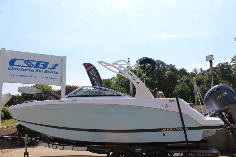 Slide: The Image of 2025 Four Winns HD3 OB boat displayed at Charlotte Ski Boats dealership. - 8