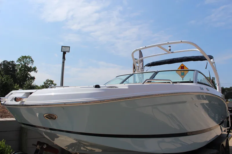 Slide: The Image of 2025 Four Winns HD3 OB boat under clear blue sky. - 9