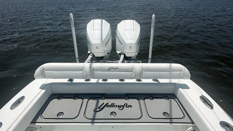 Slide: The Image of 2020 Yellowfin 26 Hybrid boat with dual Mercury engines on open water. - 8
