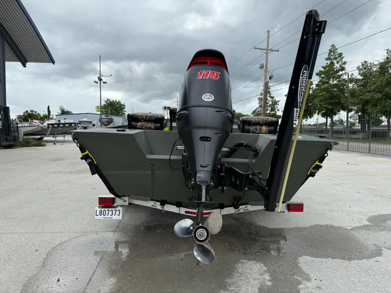 Slide: The Image of 2015 Alweld 1870 boat with 115 HP outboard motor, parked outdoors. - 5