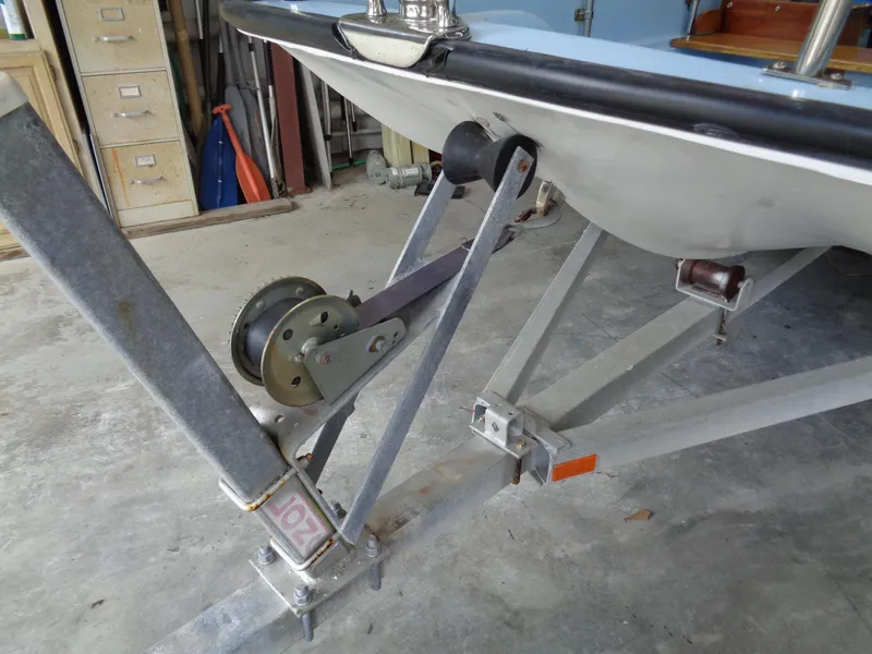 Slide: The Image of 1964 Boston Whaler 13 Sport boat on trailer in garage setting. - 16