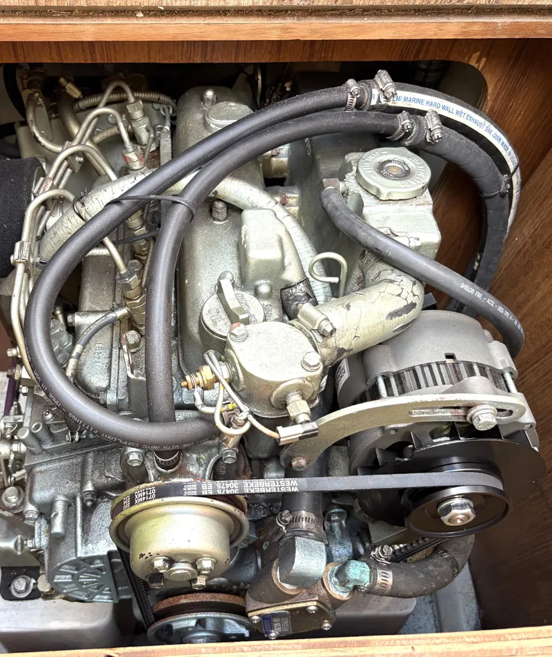 Slide: The Image of Engine of a 1998 Catalina 34 MkII sailboat, showing belts and hoses. - 22